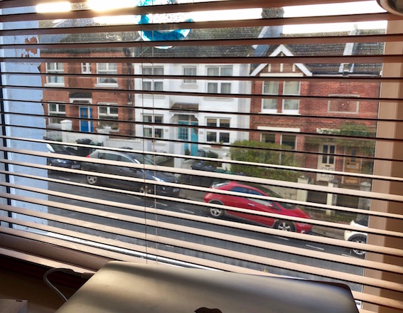 A view of my street through the window by my desk